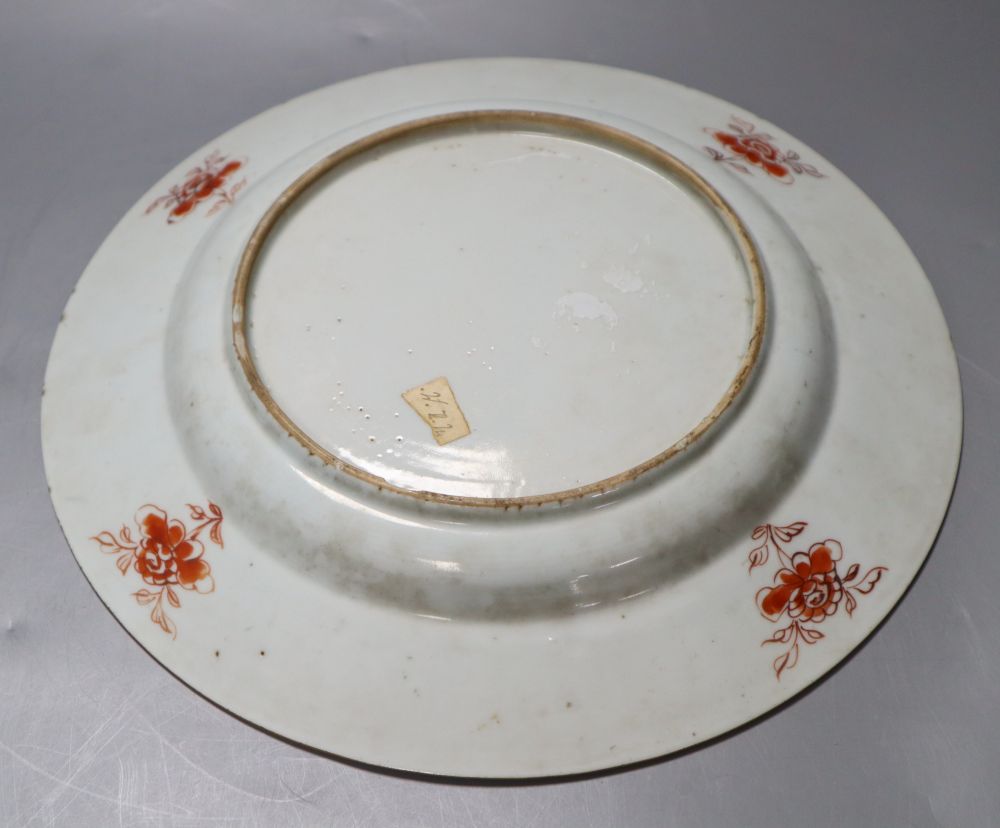 A 18th century Chinese famille rose export plate and an 18th century export teapot, cover and stand (the latter repaired)